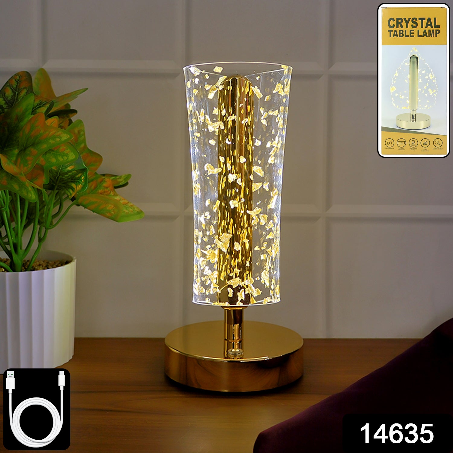 Luxury golden crystal LED table lamp by Wukusy with a sleek base and shimmering crystal accents, illuminated in a modern home setting.