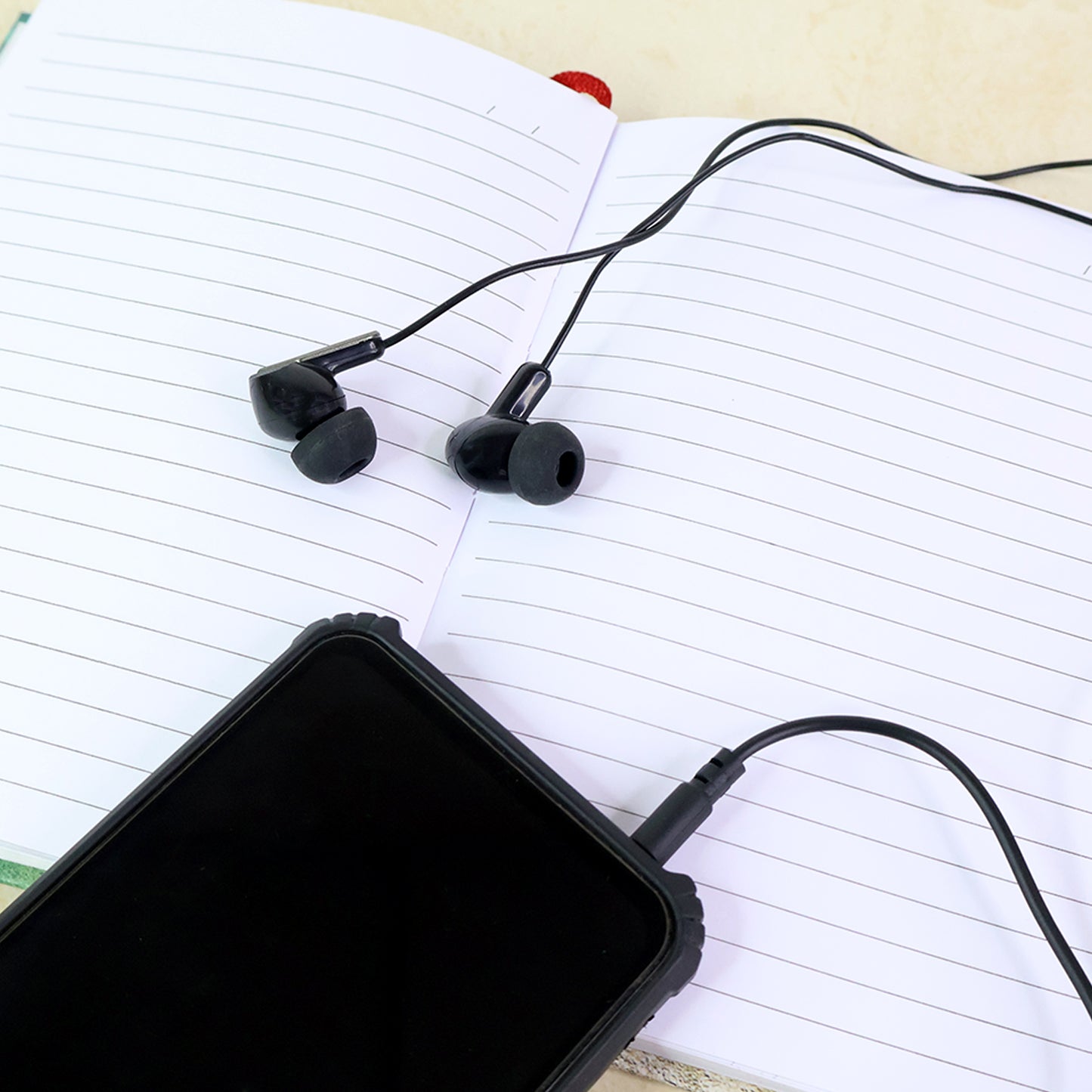 Wukusy premium wired stereo in-ear earphones with microphone and remote for mobile devices, black color, close-up view