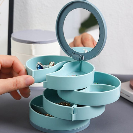 Wukusy 4083 four-layer rotating jewelry box with mirror, jewelry and earring organizer, travel-friendly accessory storage.