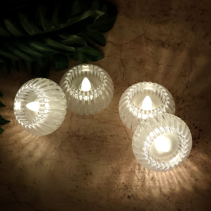 Set of four Wukusy LED flameless decorative candles for home decor, with a warm, flickering glow and realistic candle design.