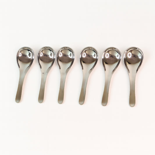 Six Wukusy Apex premium stainless steel soup spoons arranged in a set, showcasing their polished, durable design for home and kitchen use.
