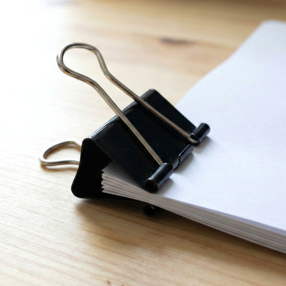 Wukusy heavy-duty black binder clips set with 40 medium 19mm clips for organizing papers and office use.
