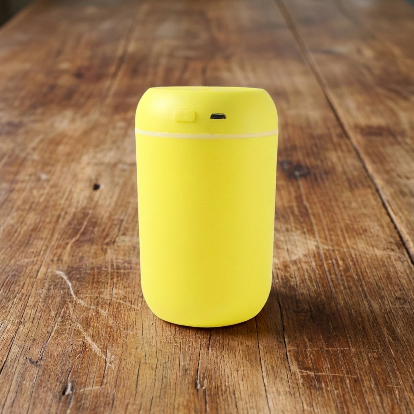Wukusy portable USB-powered mini air humidifier emitting mist, compact design suitable for desktop or travel use