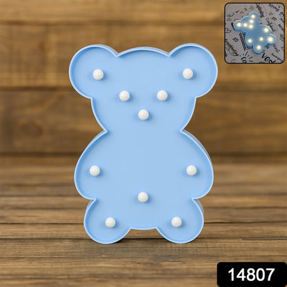 Wukusy Teddy Bear LED night light shaped like a teddy bear, used as cozy home decor for children’s rooms or bedrooms.