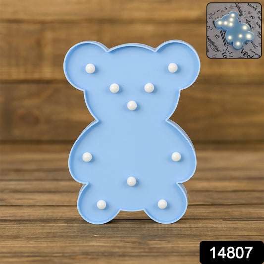 Wukusy Teddy Bear LED night light shaped like a teddy bear, used as cozy home decor for children’s rooms or bedrooms.