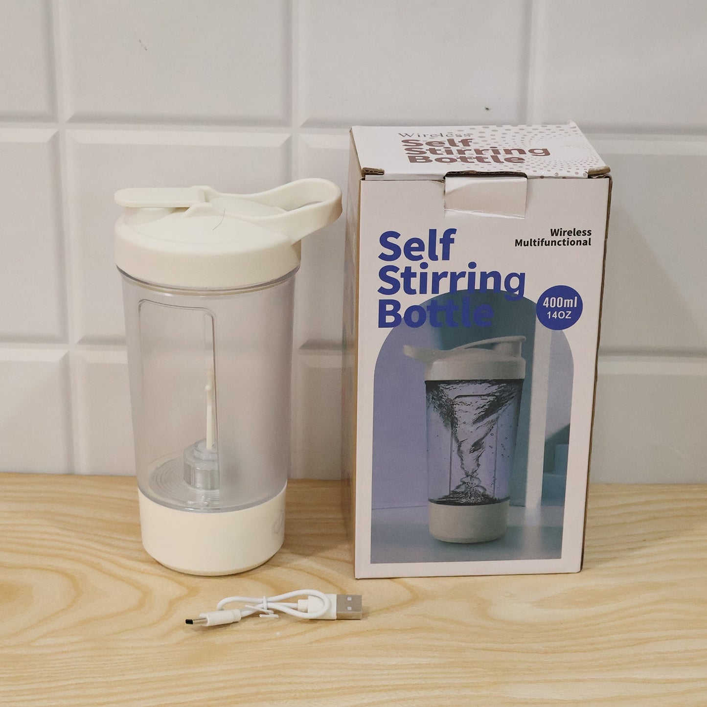 Wukusy 400ml USB rechargeable electric self-stirring protein shaker bottle with a transparent body and black lid.