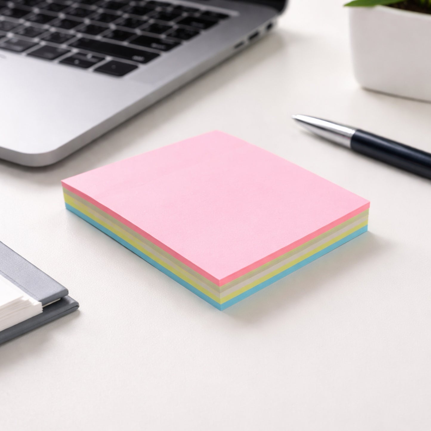 Wukusy 100-sheet sticky note pad with 3.3-inch size for quick notes, featuring bright yellow pages and adhesive backing.