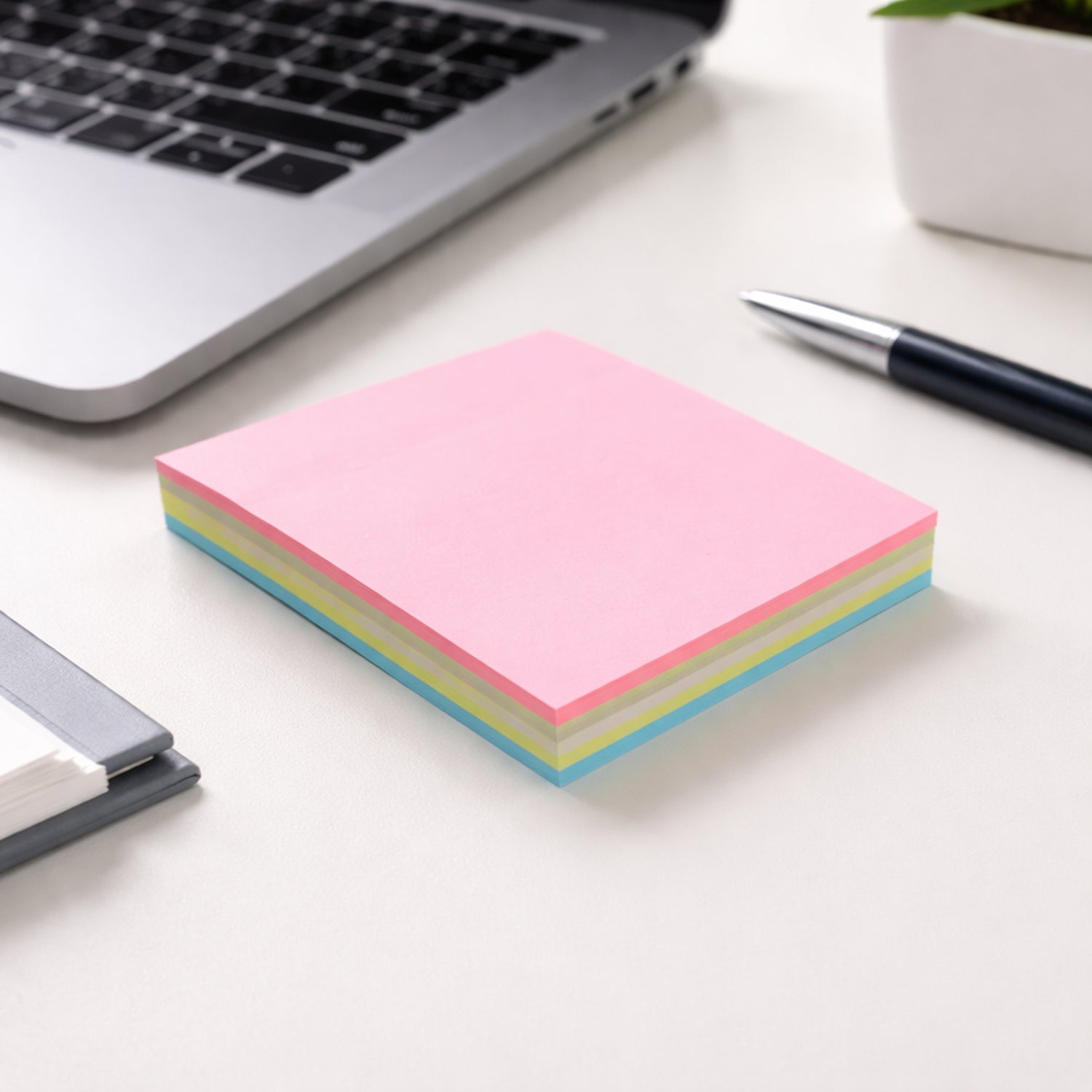 Wukusy 100-sheet sticky note pad with 3.3-inch size for quick notes, featuring bright yellow pages and adhesive backing.