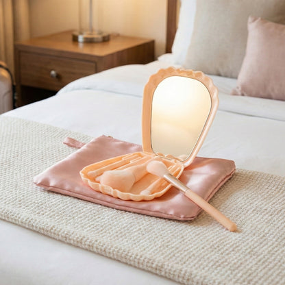 Wukusy 5-in-1 makeup brush set with mirror in a compact cosmetic box, featuring various brushes for face and eye makeup.