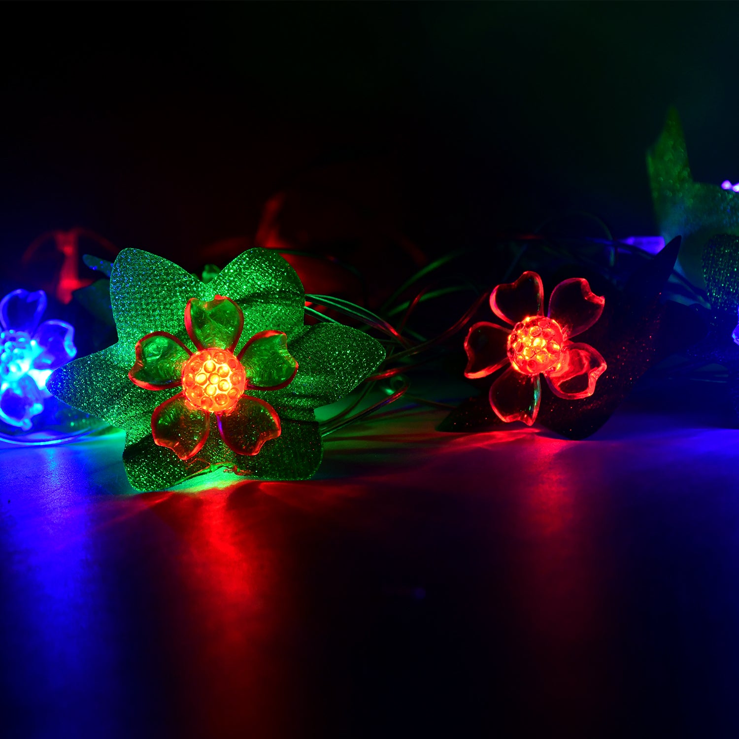 Wukusy leaf and flower LED decorative string light, 3 meters long, illuminated with colorful leaf and flower designs.