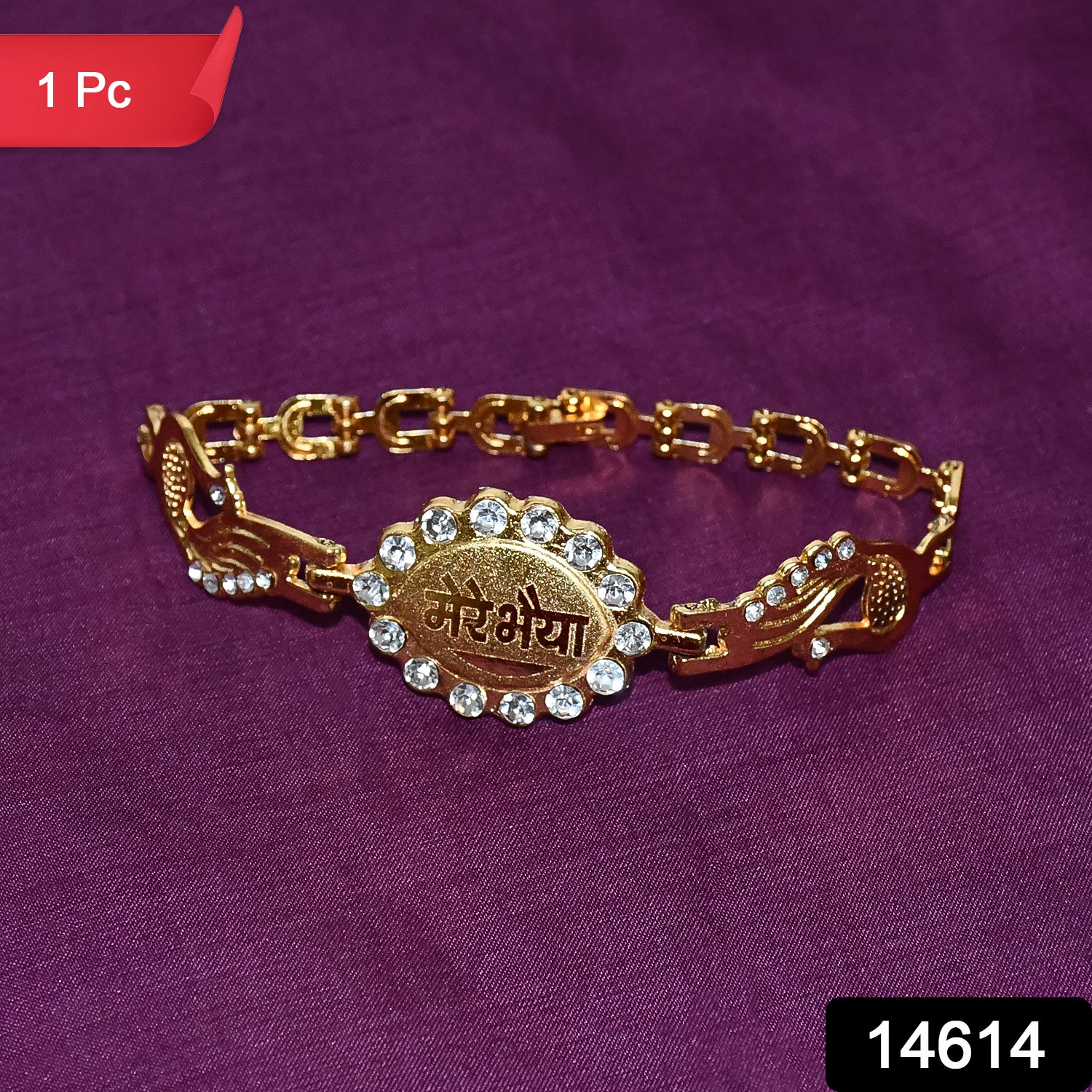 Elegant bracelet with stone border and dual peacock chain ends, featuring traditional rakhi design by Wukusy.