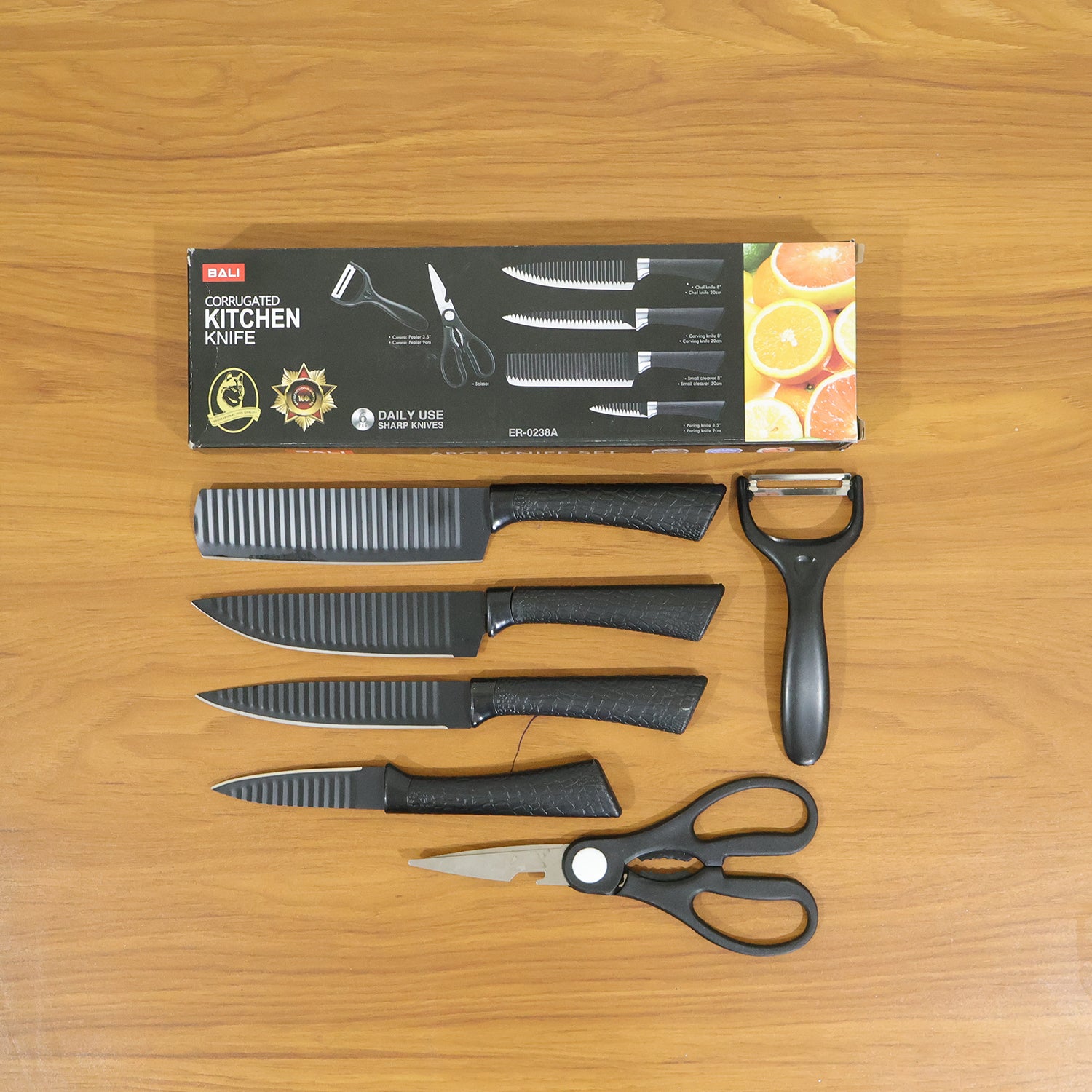 Wukusy 6-in-1 premium kitchen knife set with various stainless steel knives and a wooden storage block on a countertop.