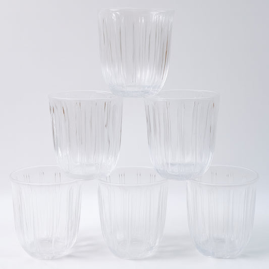 Six transparent glass tumblers from Wukusy's premium 256ml set, ideal for beverages in home and kitchen use.