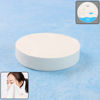 Wukusy compressed travel bath towel unfolded, showing soft, lightweight fabric and compact size 70x10 cm for easy packing.