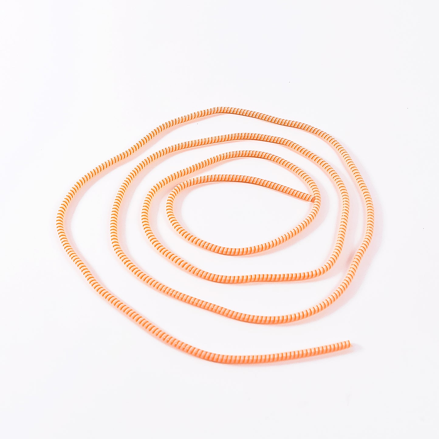 Flexible spiral cable protector sleeve for mobile accessories by Wukusy, showing coiled black protective sleeve for cables.