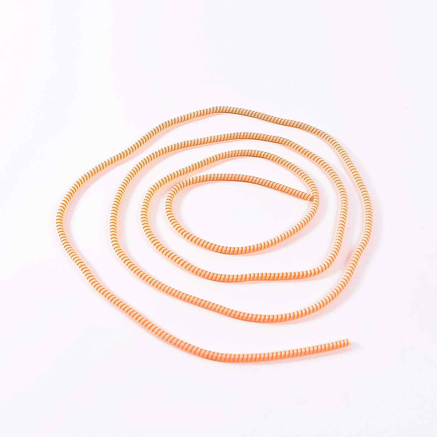 Flexible spiral cable protector sleeve for mobile accessories by Wukusy, showing coiled black protective sleeve for cables.