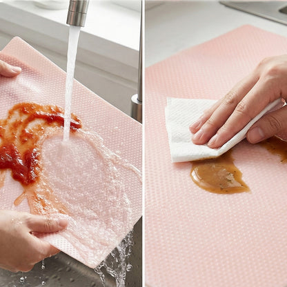 Set of four transparent plastic fridge mats measuring 45x29 cm by Wukusy, shown spread out inside a refrigerator.