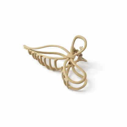 Wukusy minimalist matte finish hair claw clip for women, stylish and elegant accessory for securing hair.