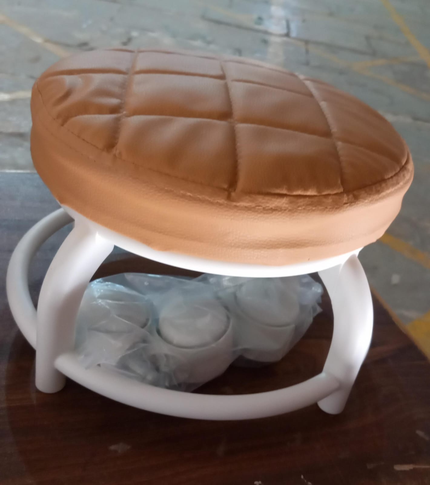 Wukusy low height roller seat stool with four wheels, compact design, suitable for garage, home, or library use.