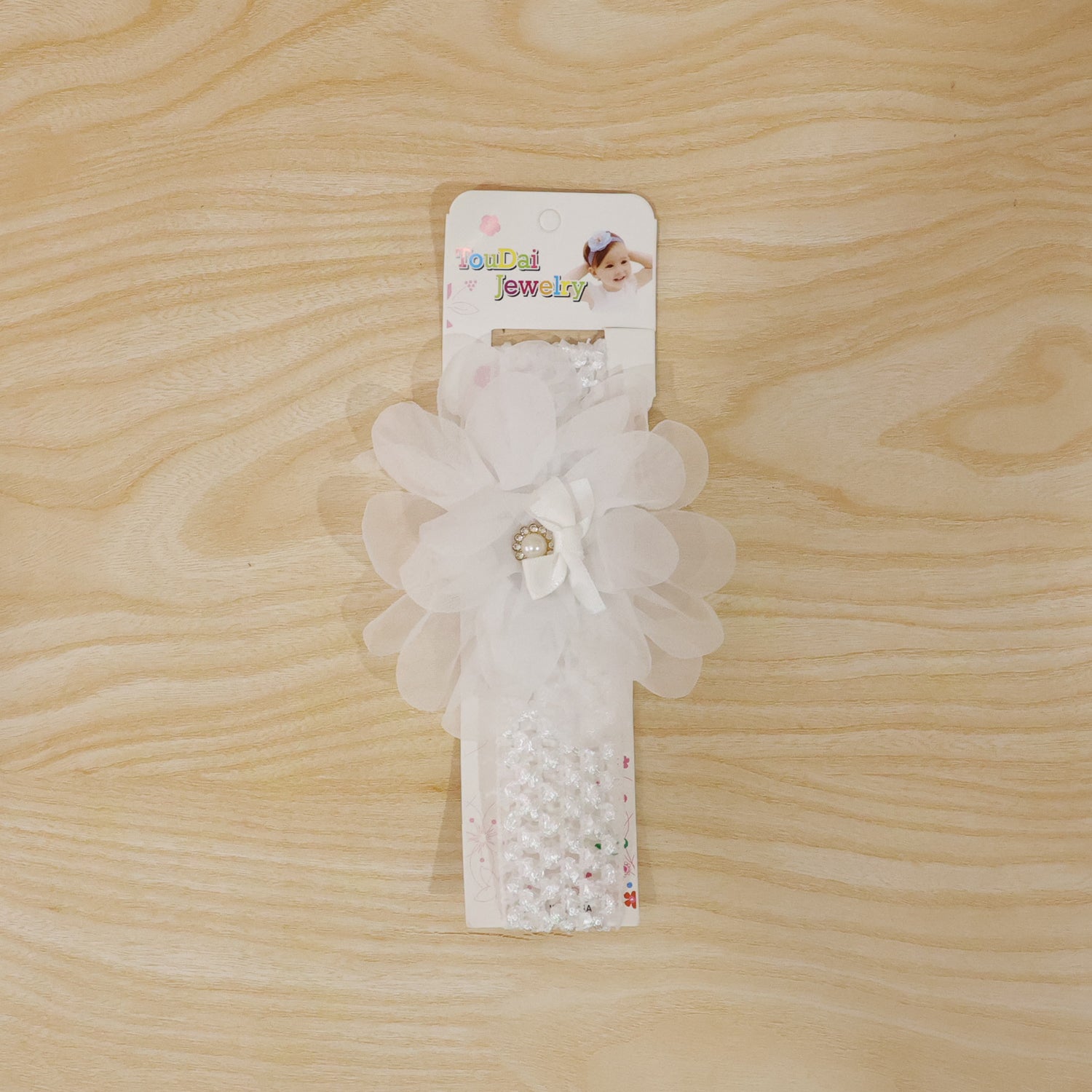 Cute soft elastic floral baby headband by Wukusy, stylish stretchable hair accessory for infants with colorful floral design.