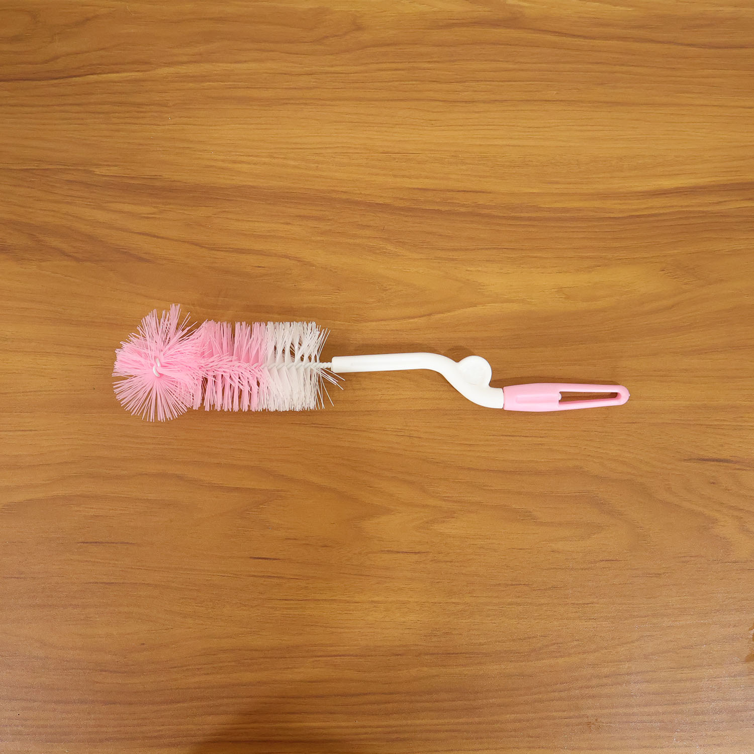Wukusy bottle nipple cleaning brush with 360 rotary handle, designed for thorough cleaning of baby bottles and nipples.