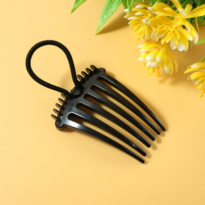Wukusy volumizing hair bun comb clip holding a styled bun for a natural, full look with a sleek black design.