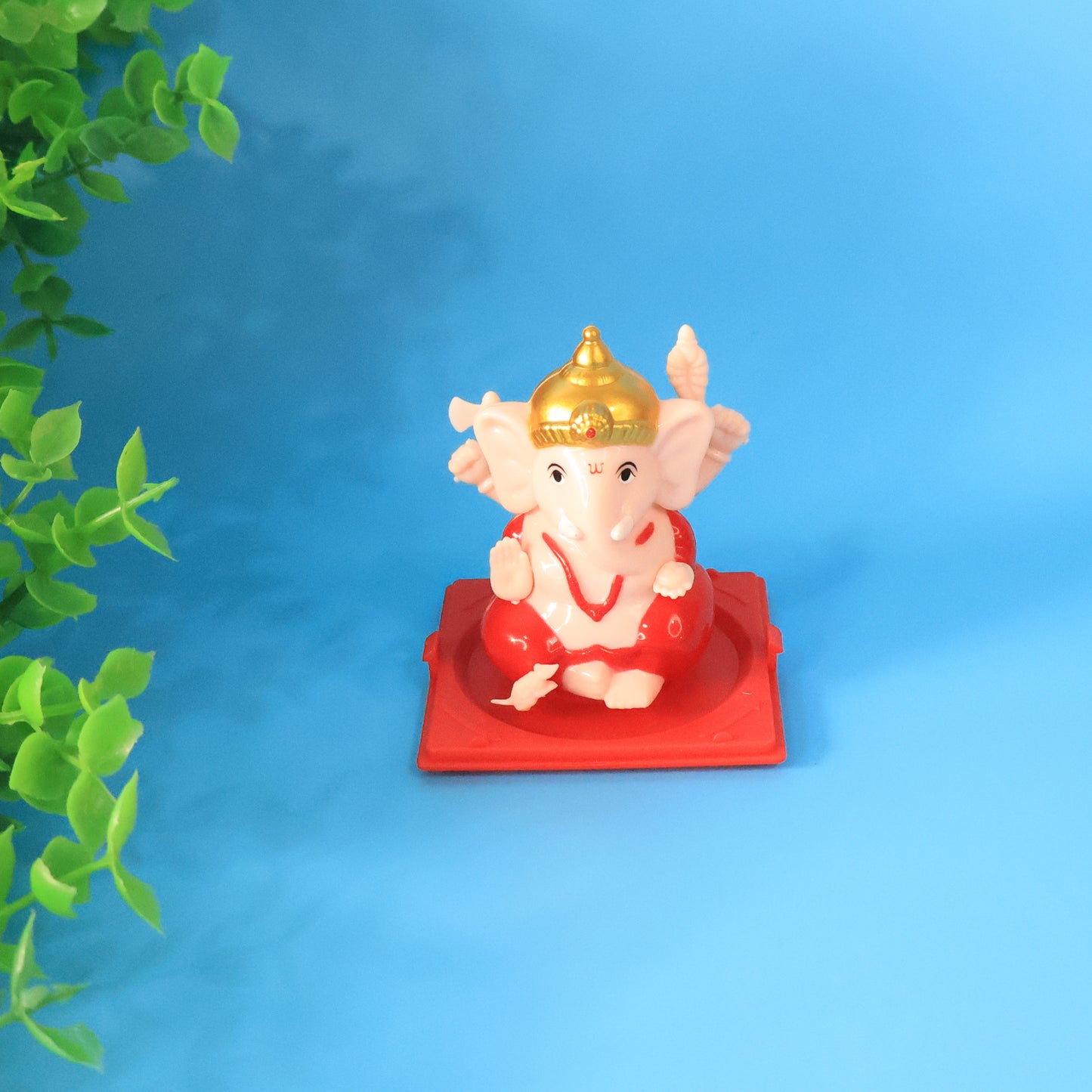 Small Lord Ganesh decorative idol in a transparent case, ideal for home decor, by Wukusy.
