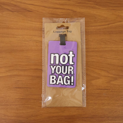 Wukusy travel luggage bag tag with bold "Not Your Bag" text, featuring a durable design and adjustable strap for easy identification.
