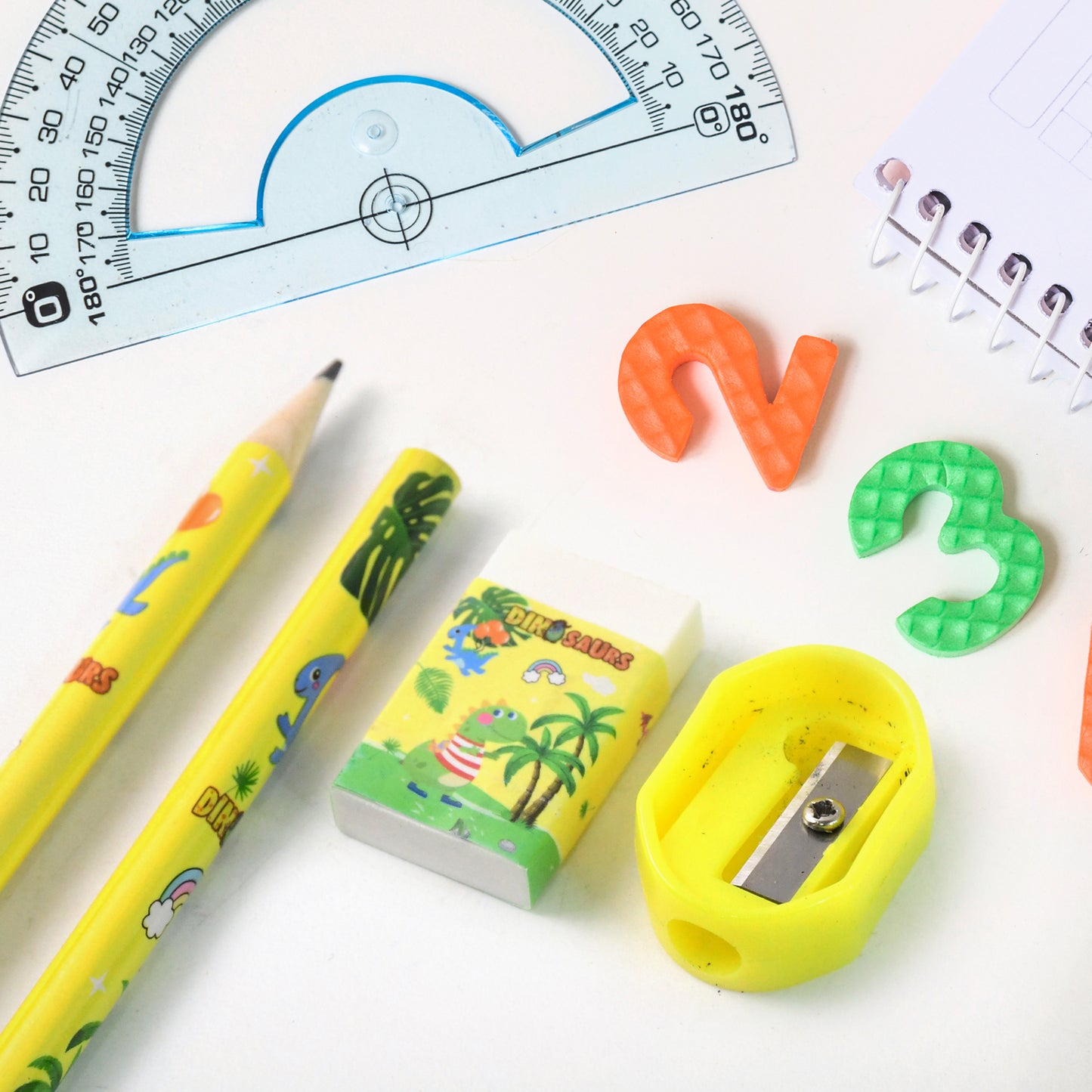 Kids dinosaur printed stationery set by Wukusy with colorful notebooks, pencils, and fun dinosaur designs for children.