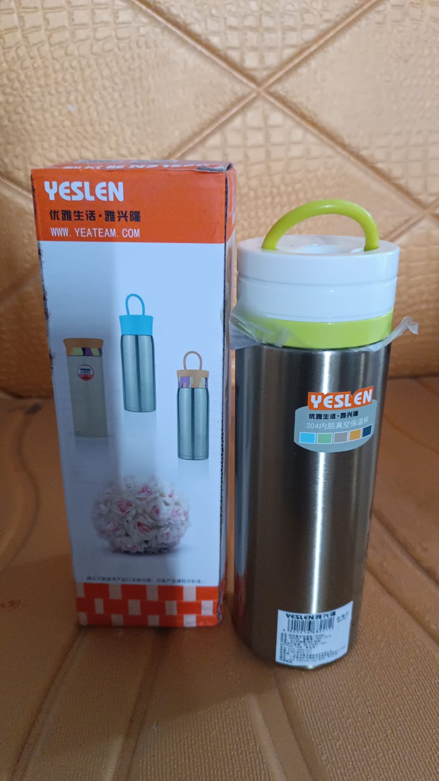Stainless steel double wall water bottle with 300ml capacity, Wukusy brand, featuring a sleek silver finish and insulated design.