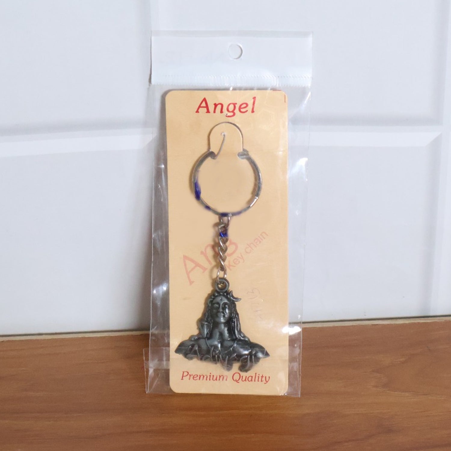 Wukusy Adiyogi Shiva face metal keychain featuring detailed Shiva face design on a small, durable keychain object.