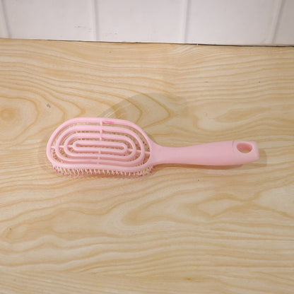Wukusy curved vented styling massage hair brush with detangling comb for men and women, showing bristles and ergonomic design.