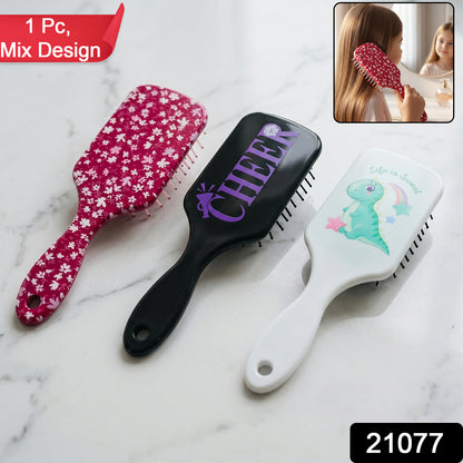 Colorful Wukusy kids hair brush with fun design, featuring soft bristles and ergonomic handle for gentle hair detangling.
