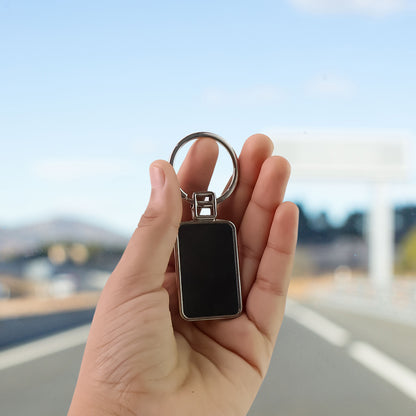Black and silver metal rectangular keychain with Wukusy branding, featuring a sleek and durable design.