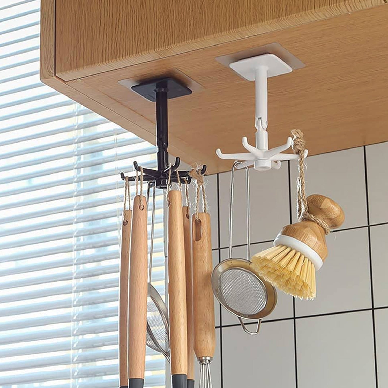 Wukusy 4644 waterproof wall-mounted hook with 360° rotating and folding design, self-adhesive for versatile hanging solutions.