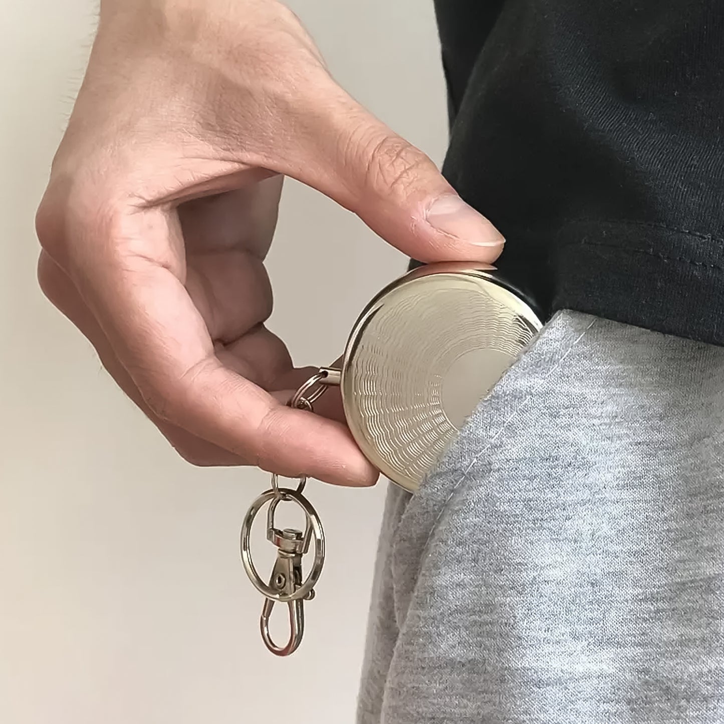 Mini pocket ashtray with keyring by Wukusy, compact black ceramic design for convenient smoking ash disposal.