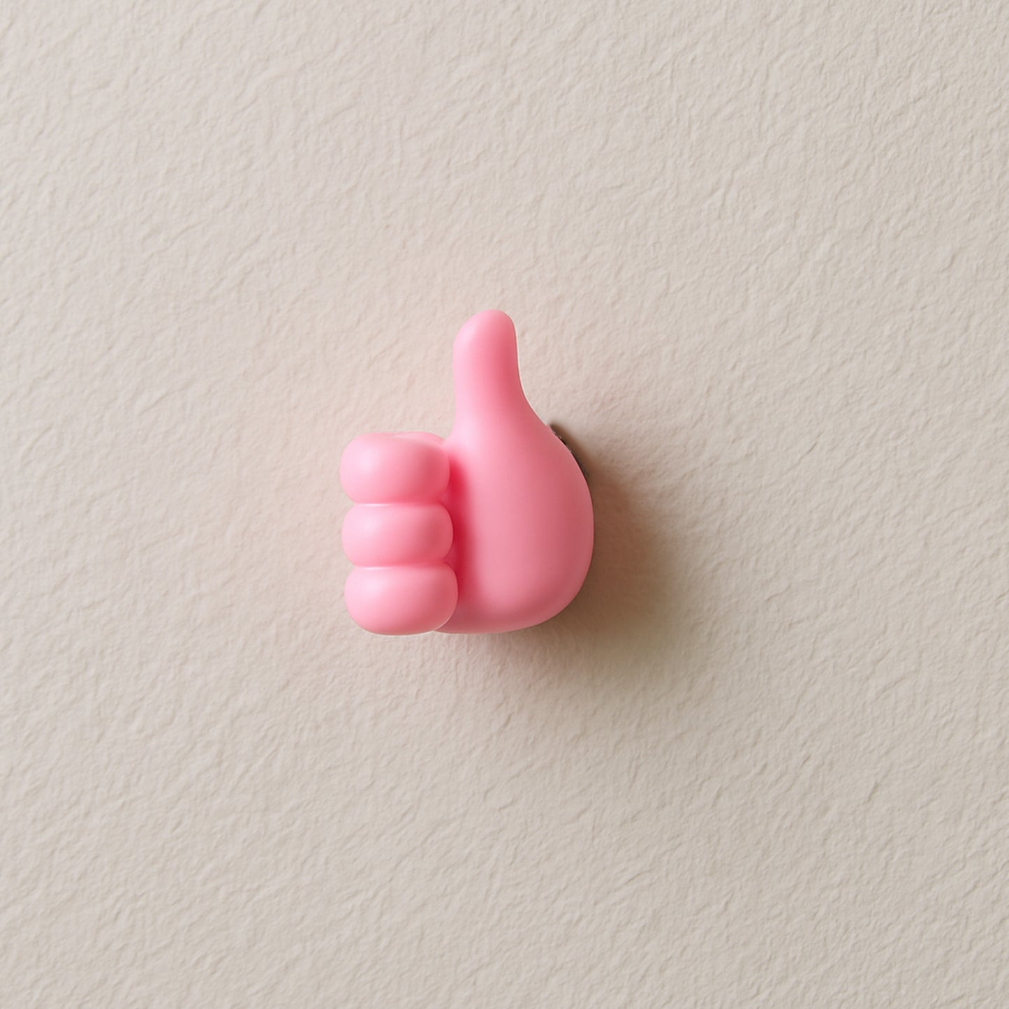 Pink Wukusy multifunctional hand-shaped wall clip hanger for keys and cables, wall-mounted with multiple gripping areas.