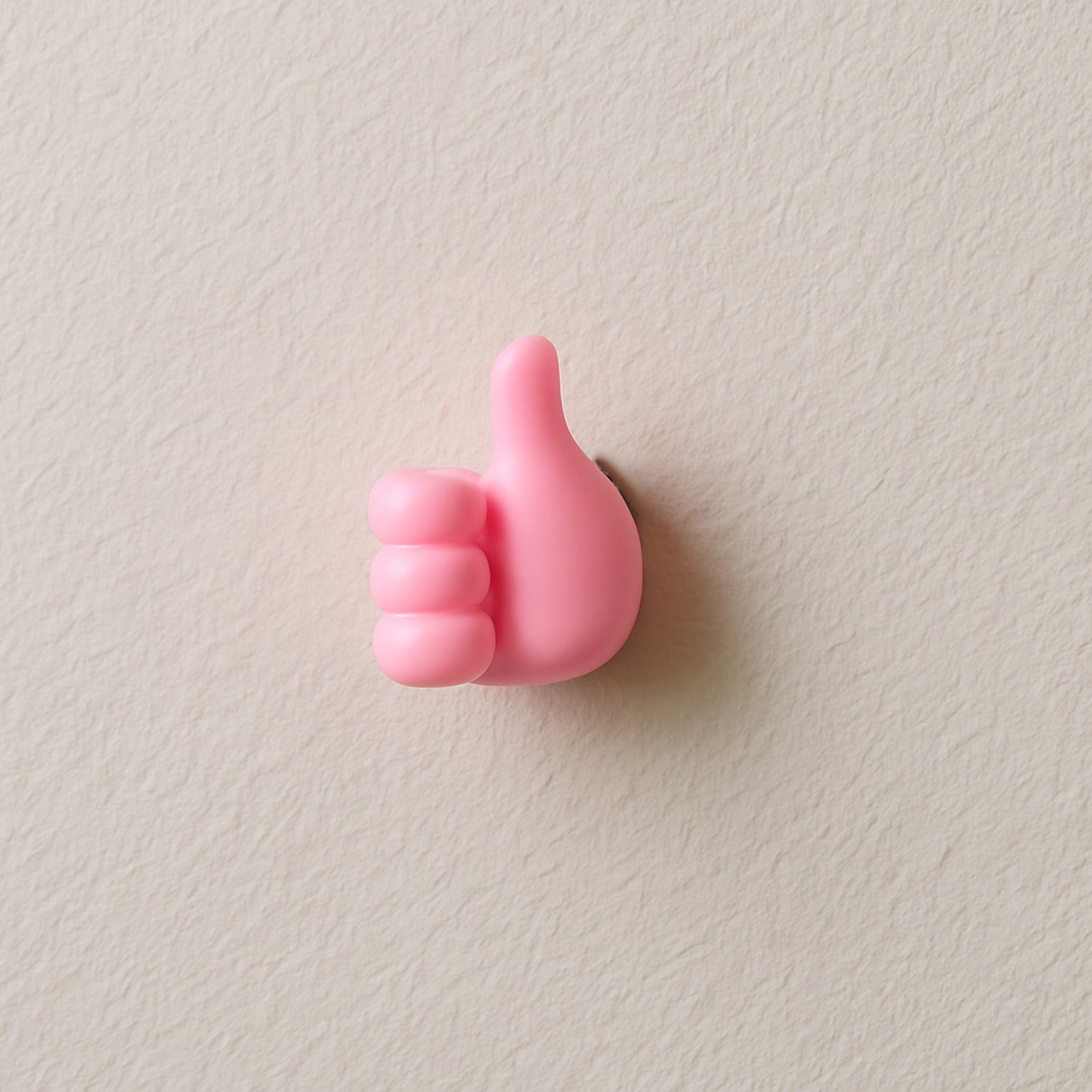 Pink Wukusy multifunctional hand-shaped wall clip hanger for keys and cables, wall-mounted with multiple gripping areas.