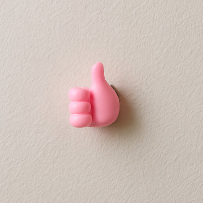 Pink Wukusy multifunctional hand-shaped wall clip hanger for keys and cables, wall-mounted with multiple gripping areas.