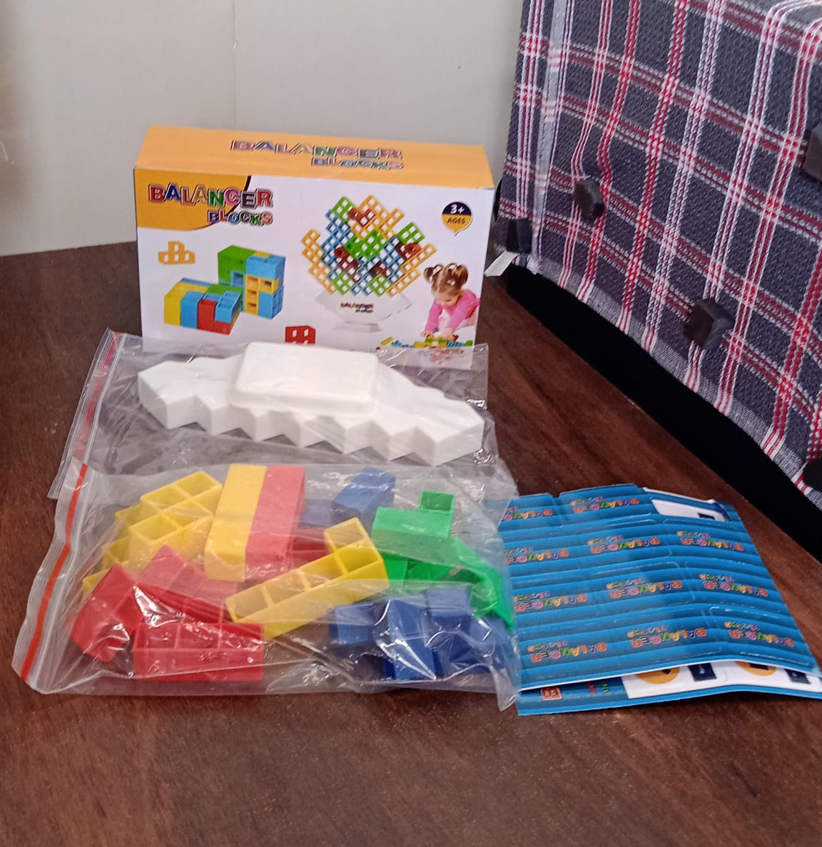 Wukusy 16-piece 3D tower stacking game with colorful blocks for kids and adults, balancing and building fun toy set.