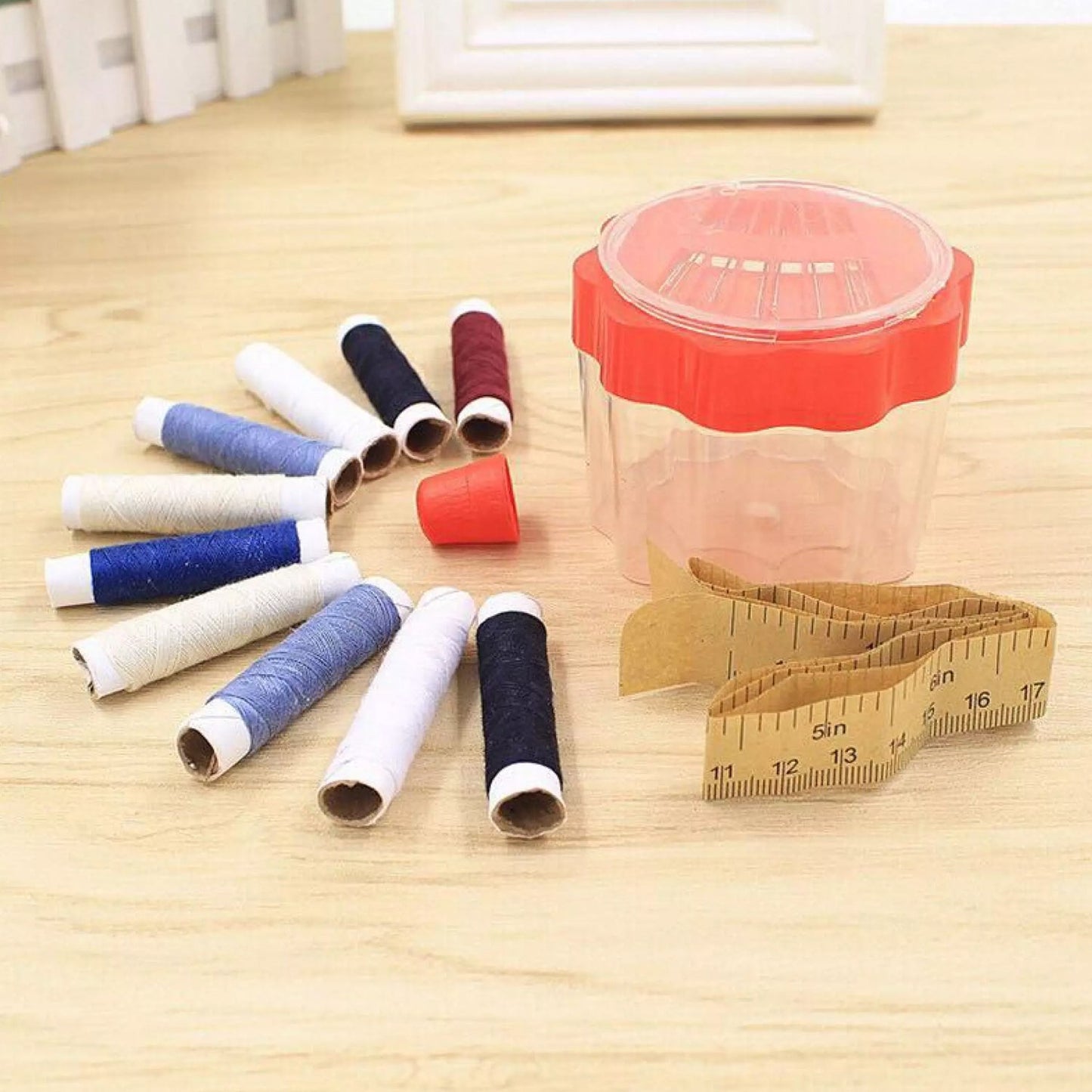 Wukusy 6050 24-piece sewing box with compartments for thread rolls and sewing accessories, used for home sewing projects
