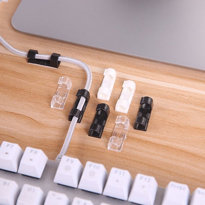Set of 20 Wukusy plastic cable clips with strong adhesive tape for organizing wires, cables, and cords in car, office, or home.