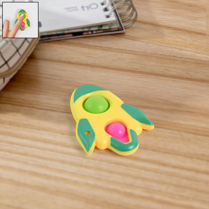 Rocket-shaped dimple keychain toy by Wukusy featuring a colorful, textured surface and a sturdy keyring attachment.
