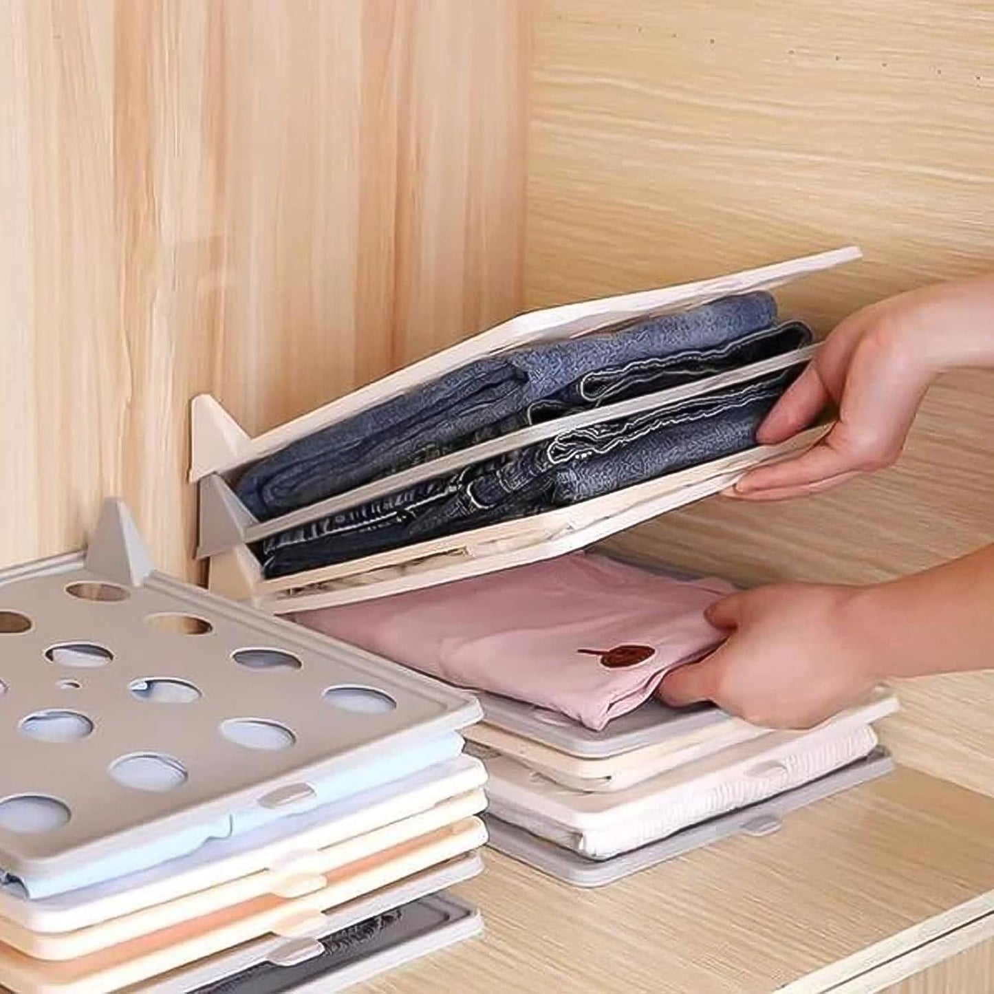 Wukusy stackable shirt clothes folding board for home organization, showing neatly folded shirts in a tidy closet.