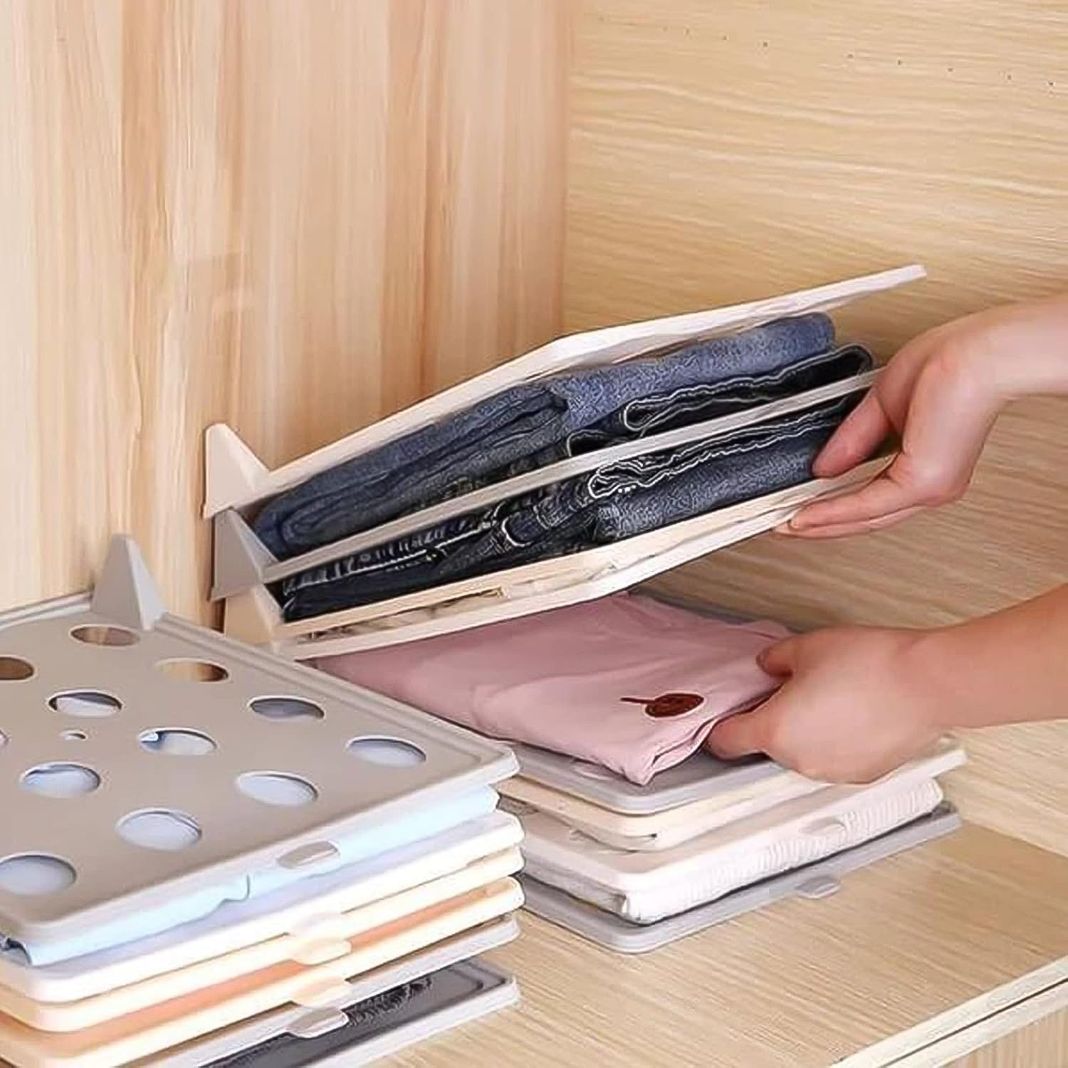 Wukusy stackable shirt clothes folding board for home organization, showing neatly folded shirts in a tidy closet.