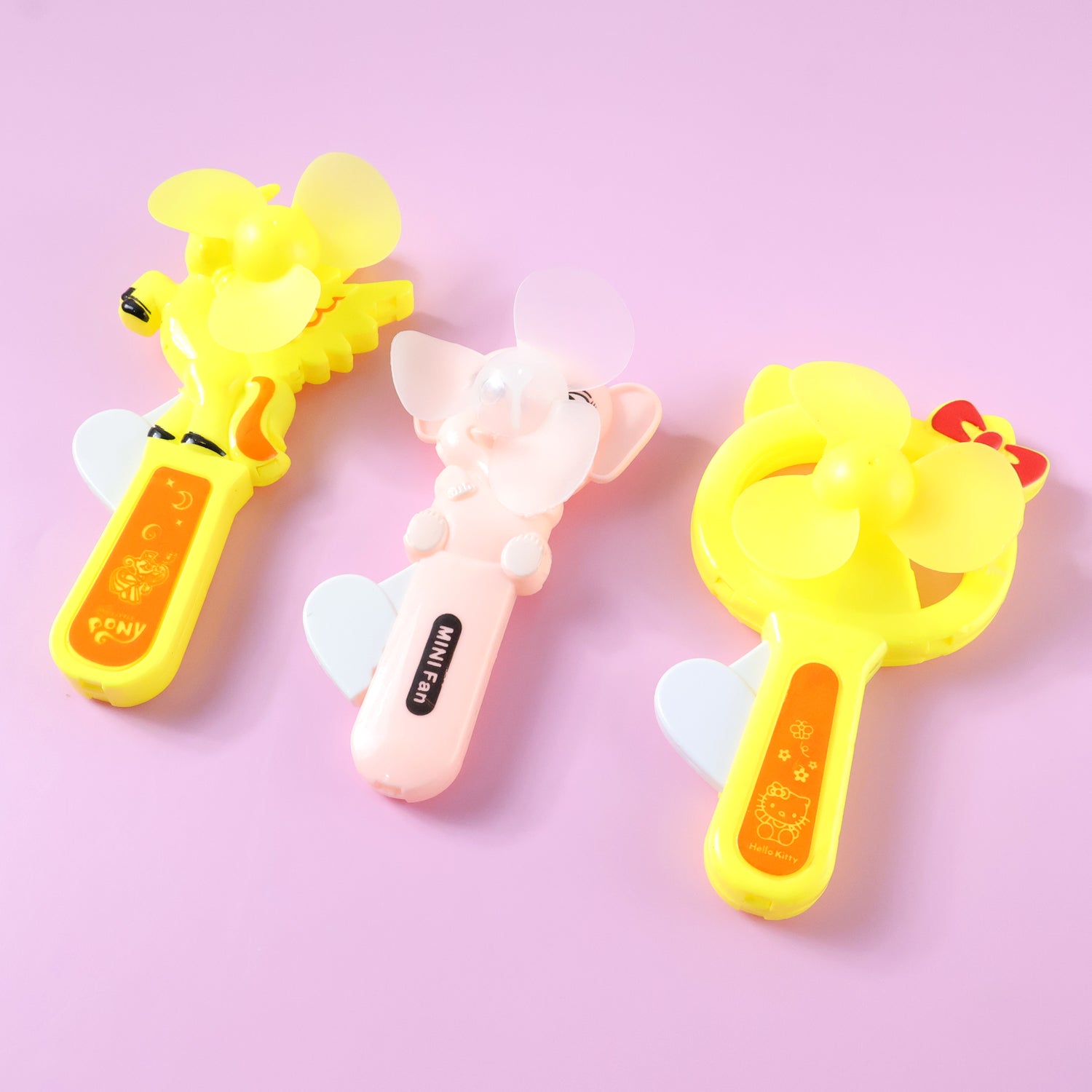 Mini portable cartoon fan toy by Wukusy, featuring a colorful hand press design and playful mixed color accents.