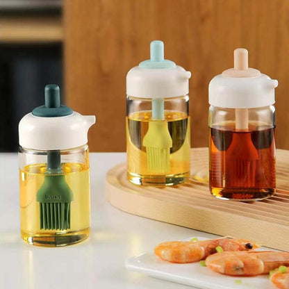 Wukusy 2-in-1 glass oil dispenser jar with brush, clear bottle for cooking or dressing, featuring a convenient pour and brush cap.
