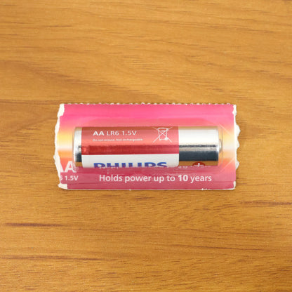 Wukusy Aa Ultra Alkaline Battery single cell with positive and negative terminals visible on a plain background