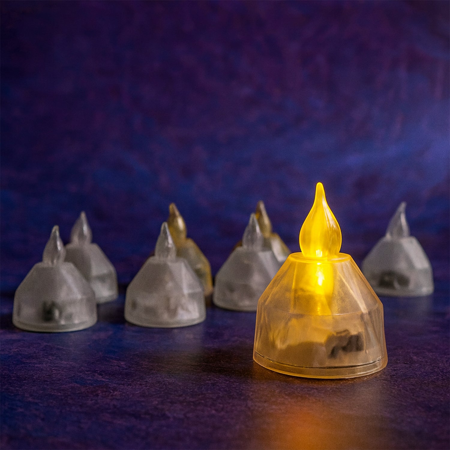 Set of 8 Wukusy LED flameless decorative diyas for home decor, showcasing warm glow and intricate design details.