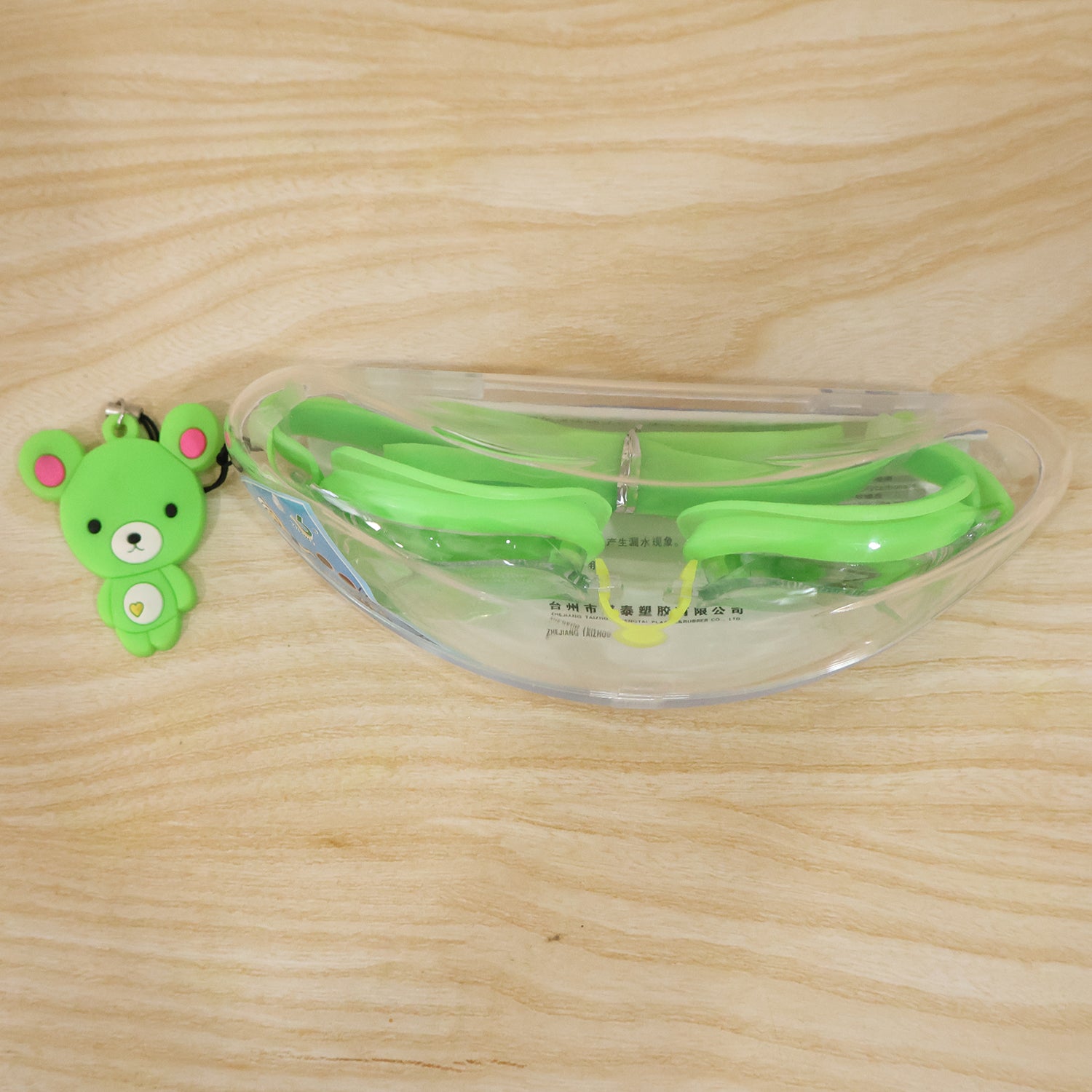 Wukusy premium swimming goggles with clear lenses and adjustable straps, stored in a protective case.
